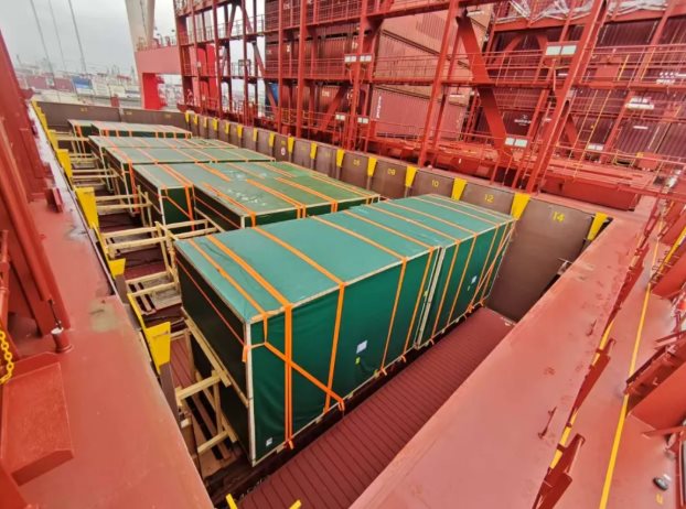 Lashed flat racks stowed in the vessel bays